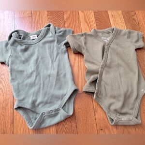 Colored Organic baby onesies in shades of green